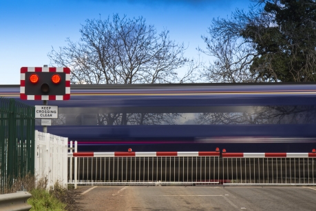 Train at level crossing